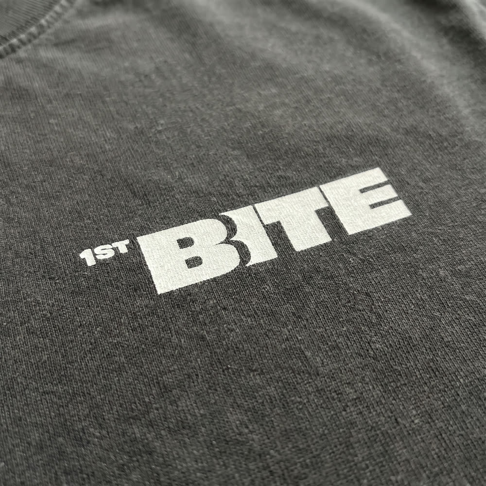 Close-up of the 1ST BITE chest print